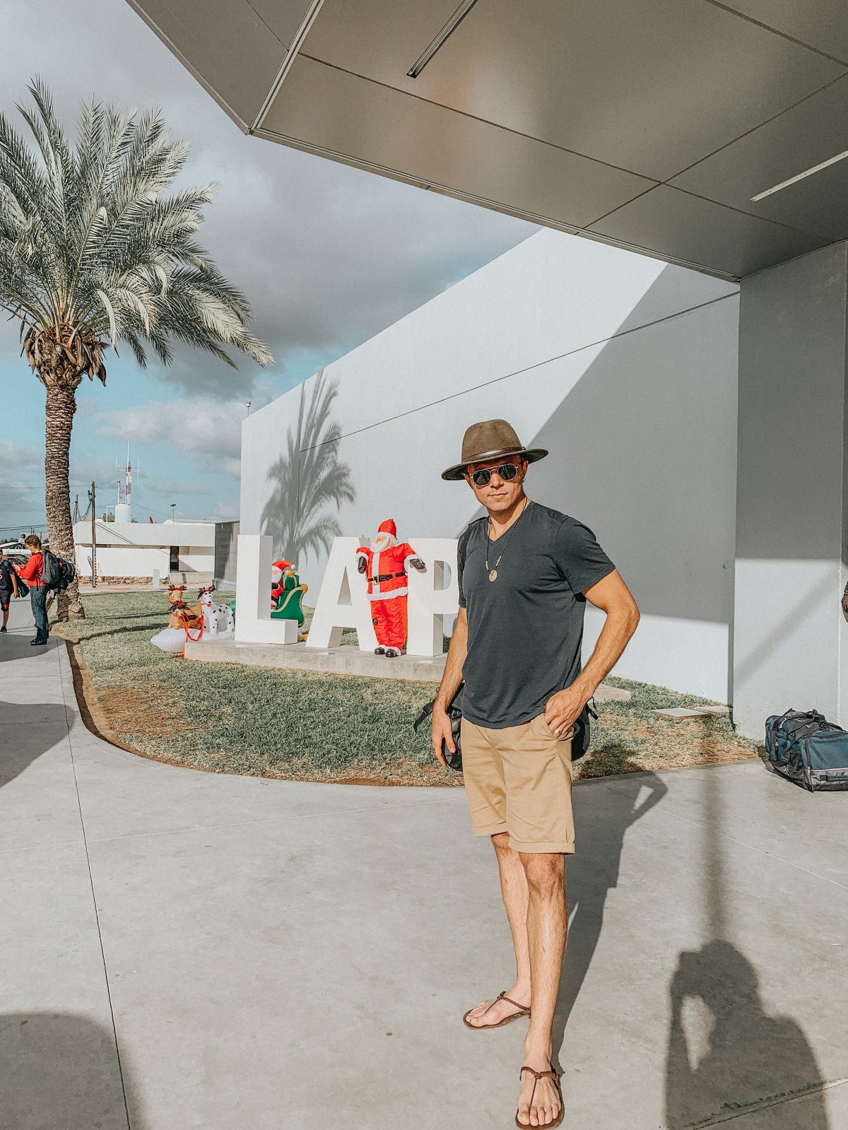  Josh, Santa, and my shadow at the La Paz airport. 