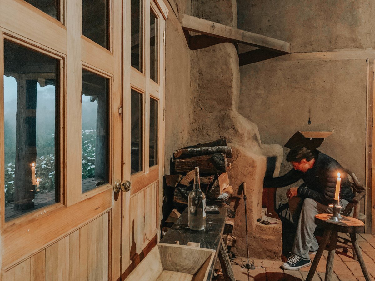 Building a fire in our adobe cabin!